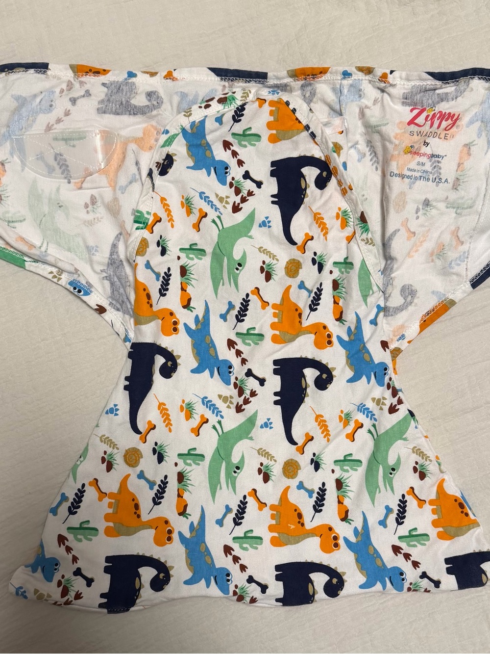 Zippy Swaddle by sleeping baby Dino Print White Swaddle Wrap